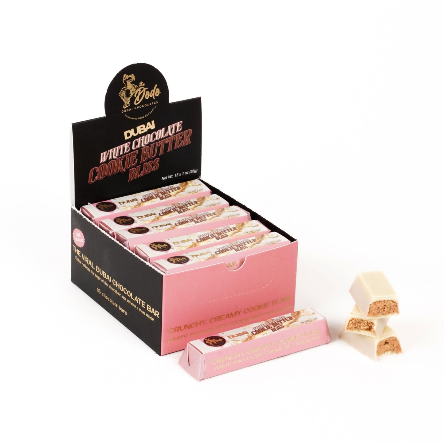 Display box of Dubai White Chocolate Cookie Butter Bars with a couple of bars on a white background